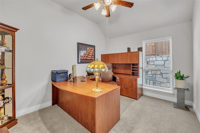 office area featuring ceiling fan, plenty of natural light, light carpet, and vaulted ceiling