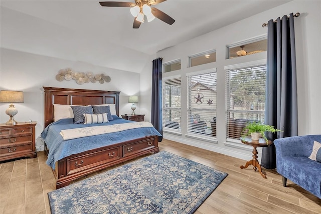 bedroom with ceiling fan and lofted ceiling