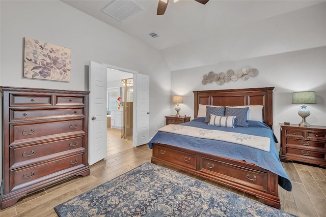 bedroom featuring connected bathroom, vaulted ceiling, and ceiling fan