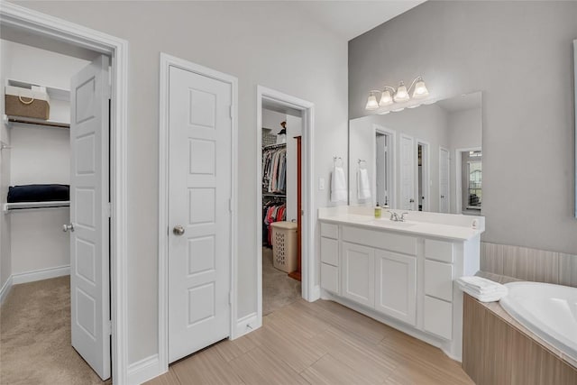 bathroom with vanity and a bathing tub