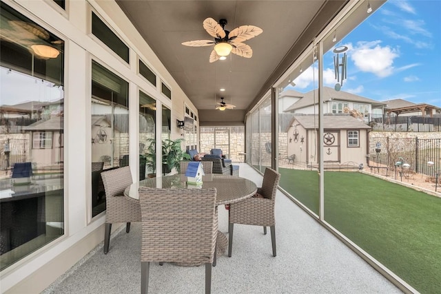 sunroom / solarium with ceiling fan