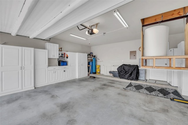 garage featuring electric panel and a garage door opener