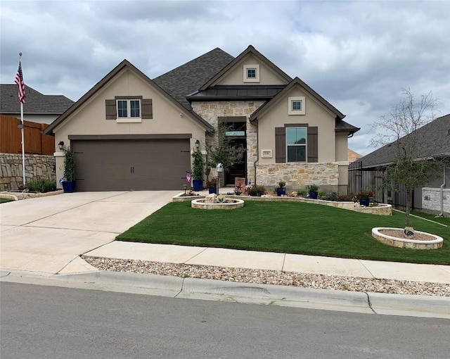 116 Berkeley Pl, Georgetown, TX 78628 - view of front of house with stucco siding, stone siding, a front lawn, driveway, and a garage