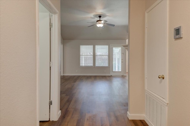 corridor featuring dark wood-type flooring