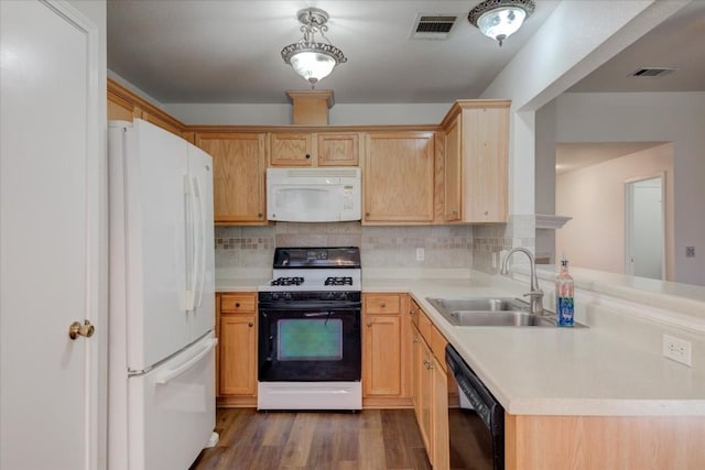 kitchen with light brown cabinets, white appliances, tasteful backsplash, and sink