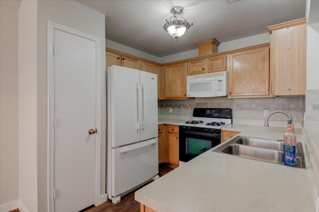 kitchen featuring sink, light brown cabinets, dark wood-type flooring, tasteful backsplash, and white appliances