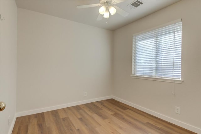 unfurnished room with light hardwood / wood-style flooring and ceiling fan