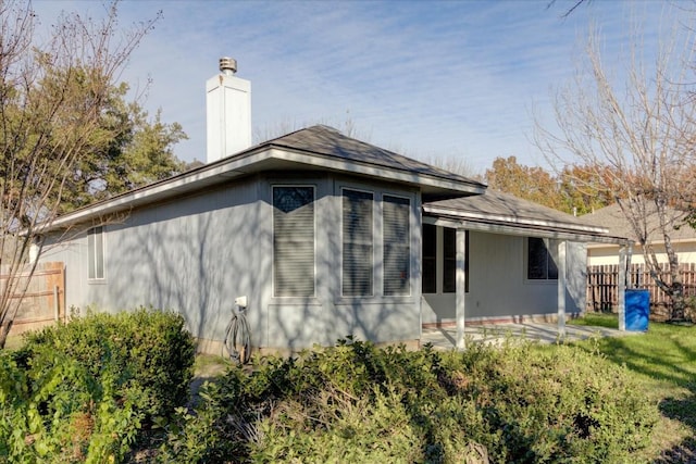 view of side of property featuring a patio area