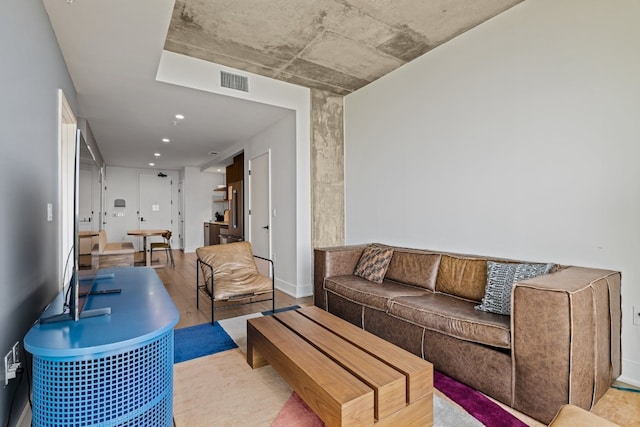 living room with light hardwood / wood-style flooring