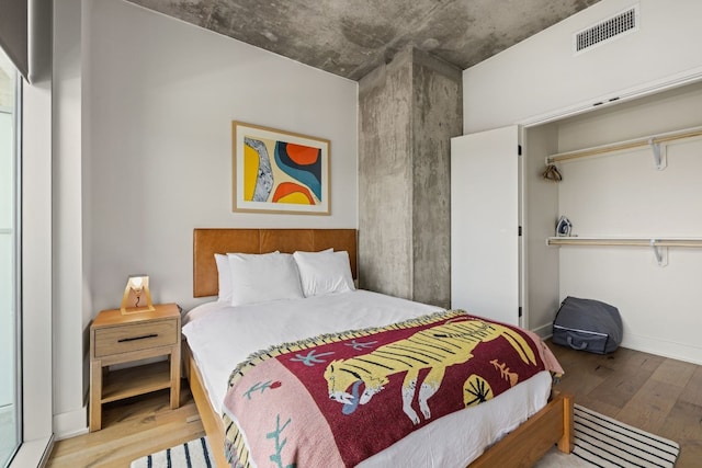 bedroom featuring a closet and light hardwood / wood-style floors