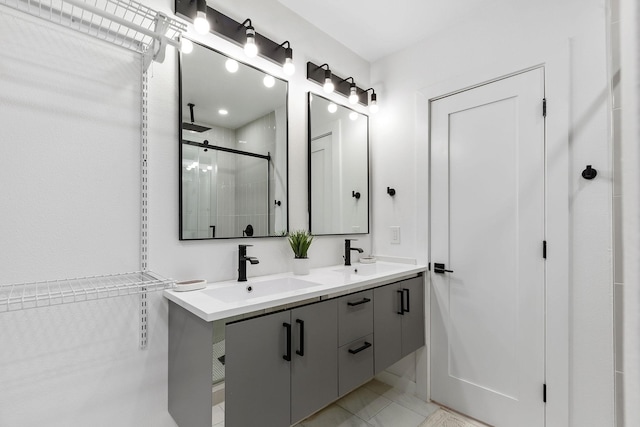 bathroom with tile patterned flooring, vanity, and an enclosed shower