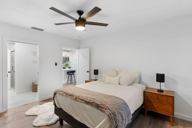 bedroom featuring dark hardwood / wood-style floors and ceiling fan