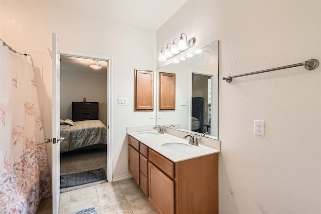 bathroom featuring tile patterned flooring and vanity