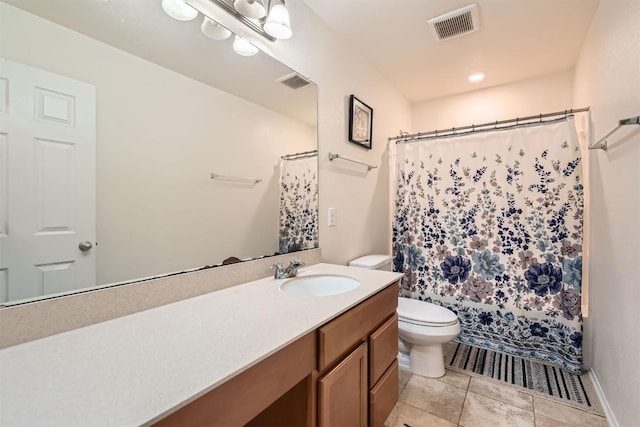 bathroom featuring tile patterned floors, walk in shower, vanity, and toilet