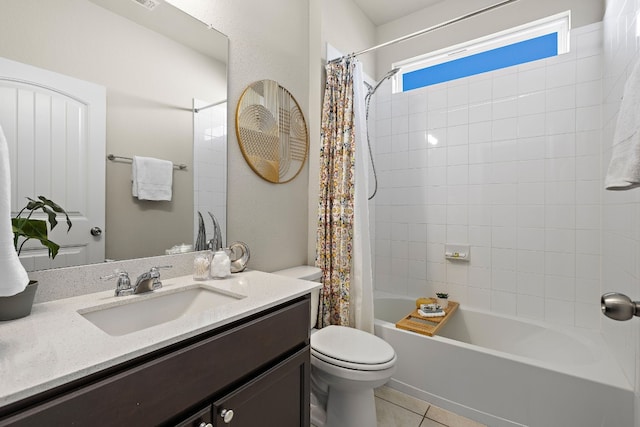 full bathroom featuring tile patterned floors, vanity, toilet, and shower / tub combo with curtain