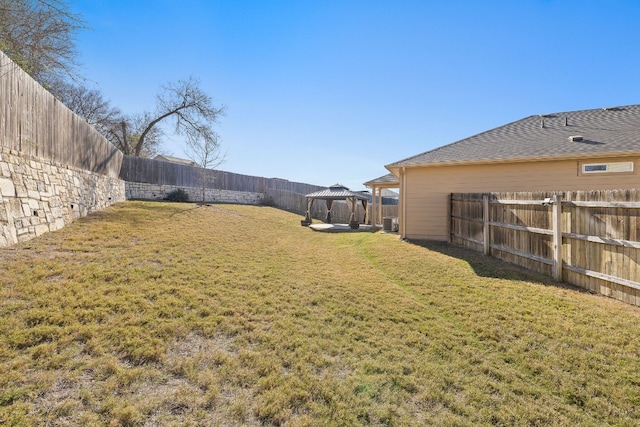 view of yard featuring a gazebo and central AC unit