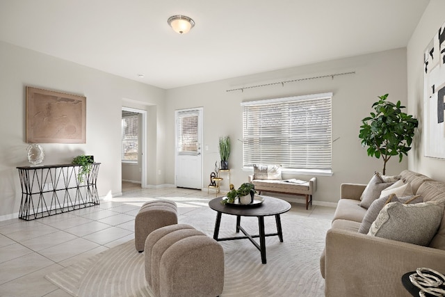 living room with a healthy amount of sunlight and light tile patterned floors