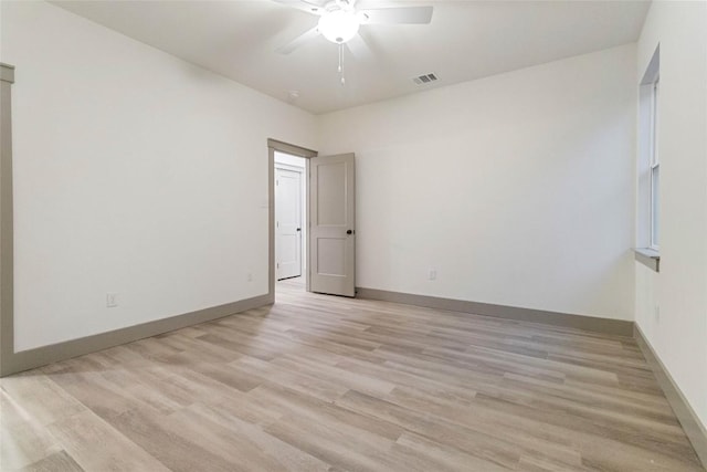 unfurnished room featuring ceiling fan and light hardwood / wood-style floors