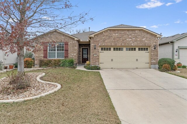 ranch-style home with a front yard and a garage