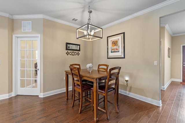 dining space featuring dark wood-style floors, ornamental molding, visible vents, and baseboards