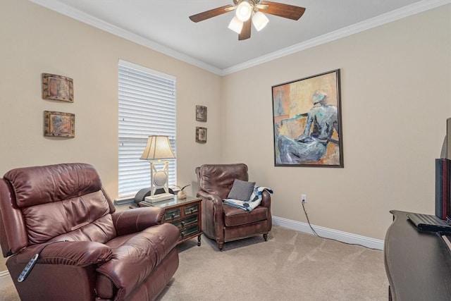 living area with a healthy amount of sunlight, ceiling fan, light colored carpet, and ornamental molding