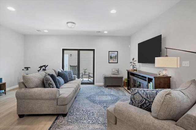 living room with light hardwood / wood-style flooring