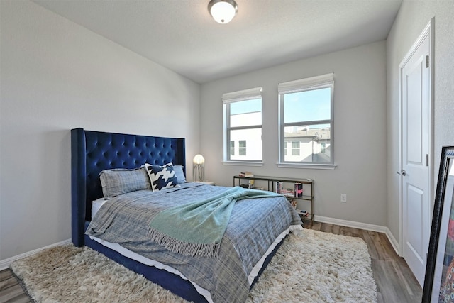 bedroom with wood-type flooring