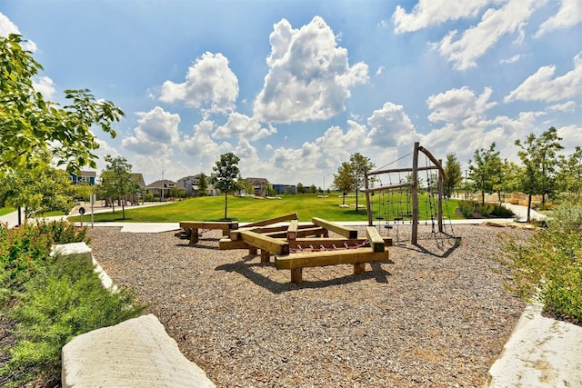 view of home's community with a playground and a yard