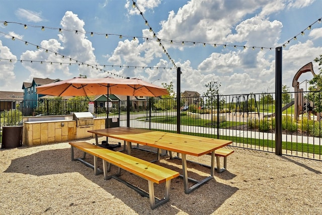 view of home's community with an outdoor kitchen