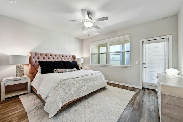 bedroom with ceiling fan and dark wood-type flooring