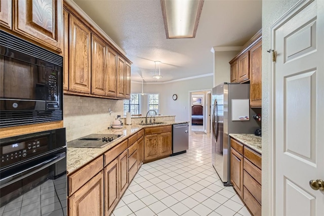 kitchen with sink, light stone counters, light tile patterned floors, black appliances, and ornamental molding