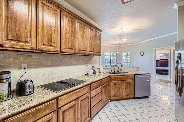 kitchen featuring appliances with stainless steel finishes, tasteful backsplash, crown molding, sink, and light tile patterned flooring