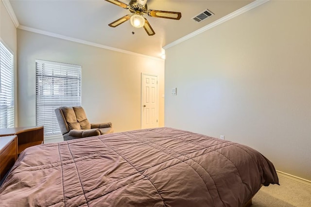 bedroom with ceiling fan, carpet floors, and crown molding