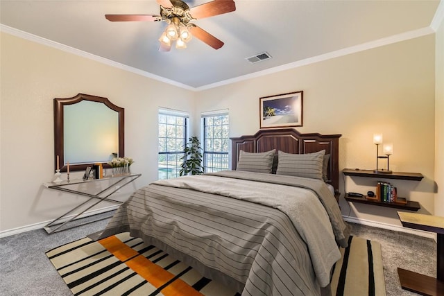 carpeted bedroom featuring ceiling fan and crown molding