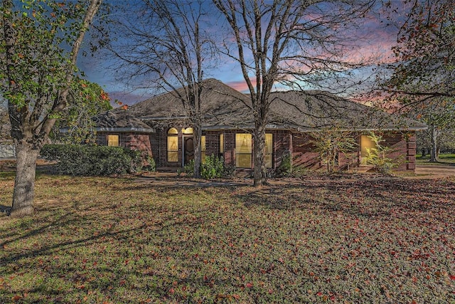 view of front of home with a yard