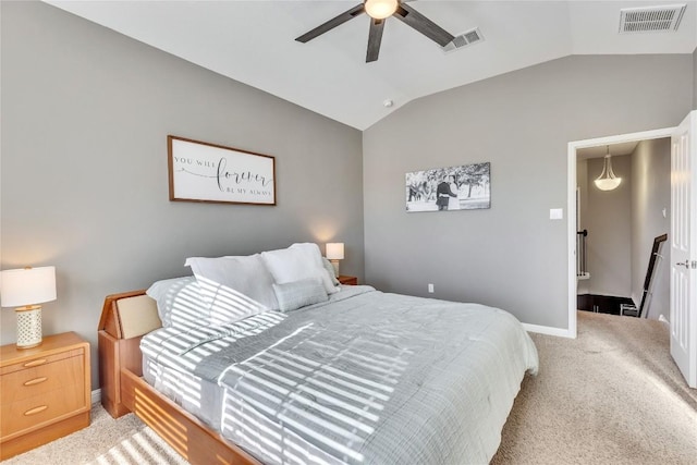 carpeted bedroom with vaulted ceiling and ceiling fan