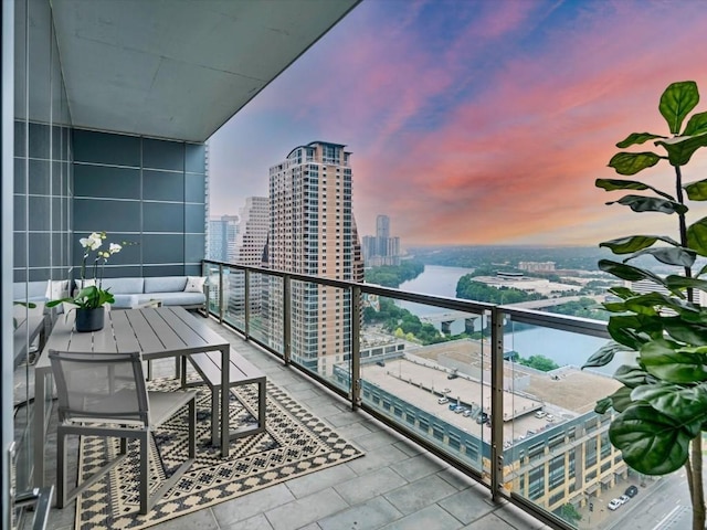 view of balcony at dusk