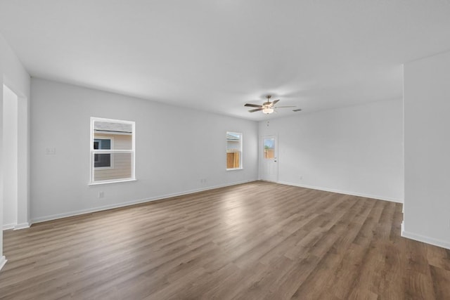 spare room featuring ceiling fan and hardwood / wood-style flooring