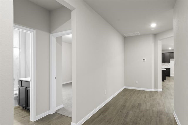 hallway featuring hardwood / wood-style floors