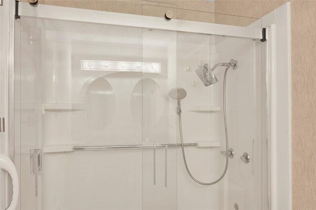 bathroom featuring an enclosed shower