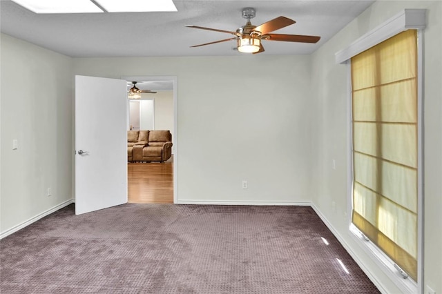 empty room with dark colored carpet