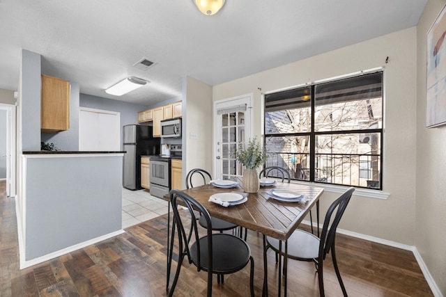 dining room with light hardwood / wood-style flooring