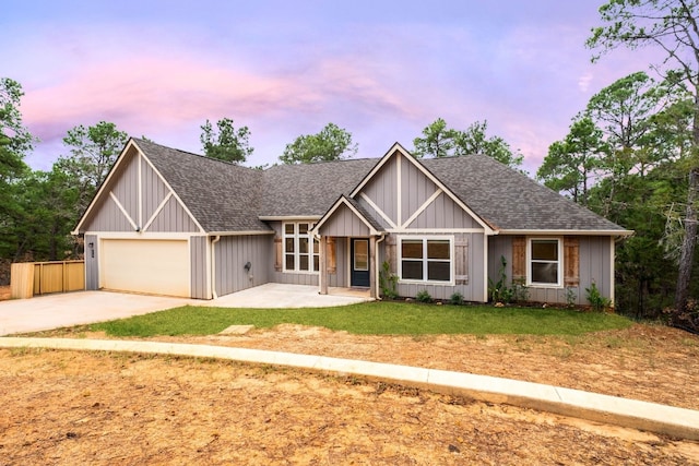 view of front of house with a lawn and a garage