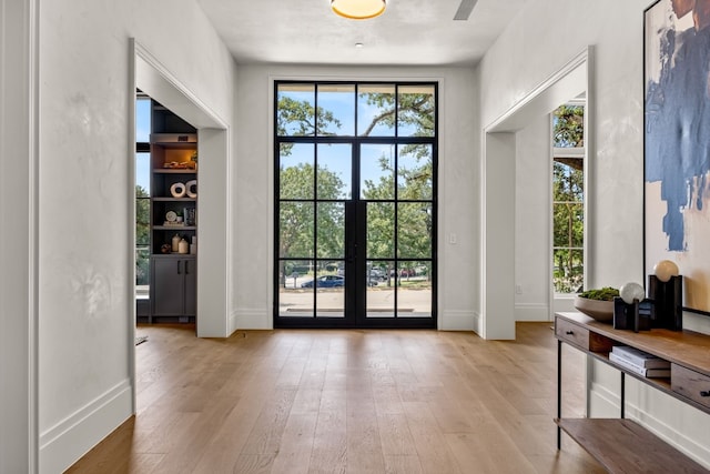 entryway featuring french doors and light hardwood / wood-style floors