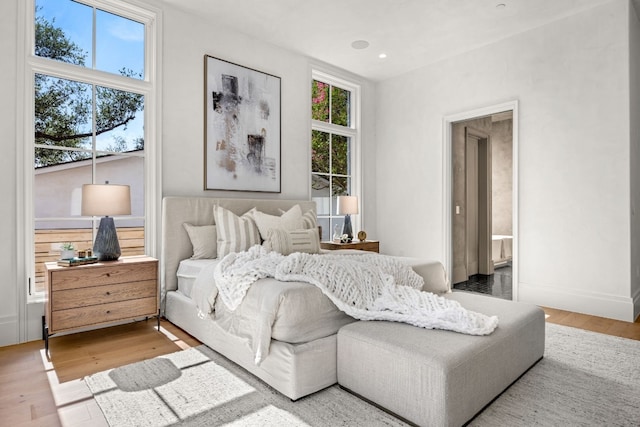 bedroom with hardwood / wood-style flooring