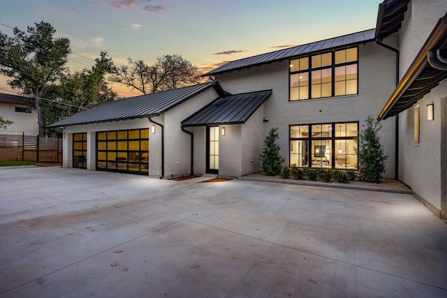 modern farmhouse featuring a garage