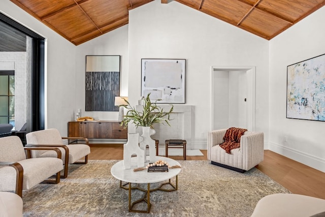 living room with a fireplace, lofted ceiling with beams, hardwood / wood-style floors, and wood ceiling