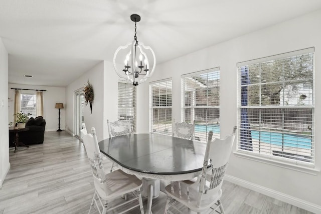 dining space with a notable chandelier