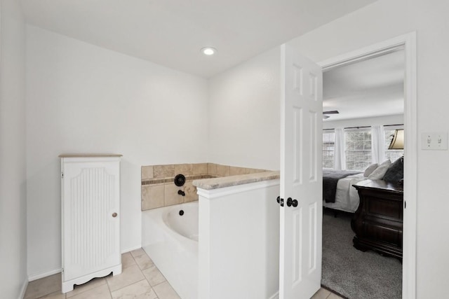 bathroom featuring tile patterned floors and a bathtub