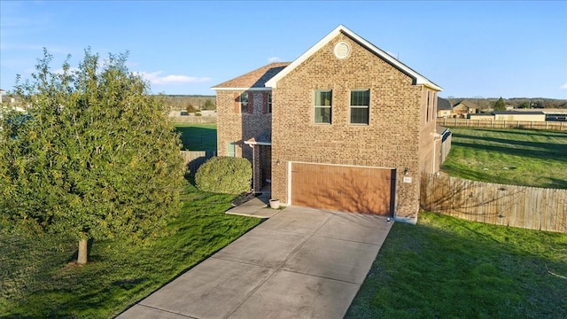 front of property with a front yard and a garage